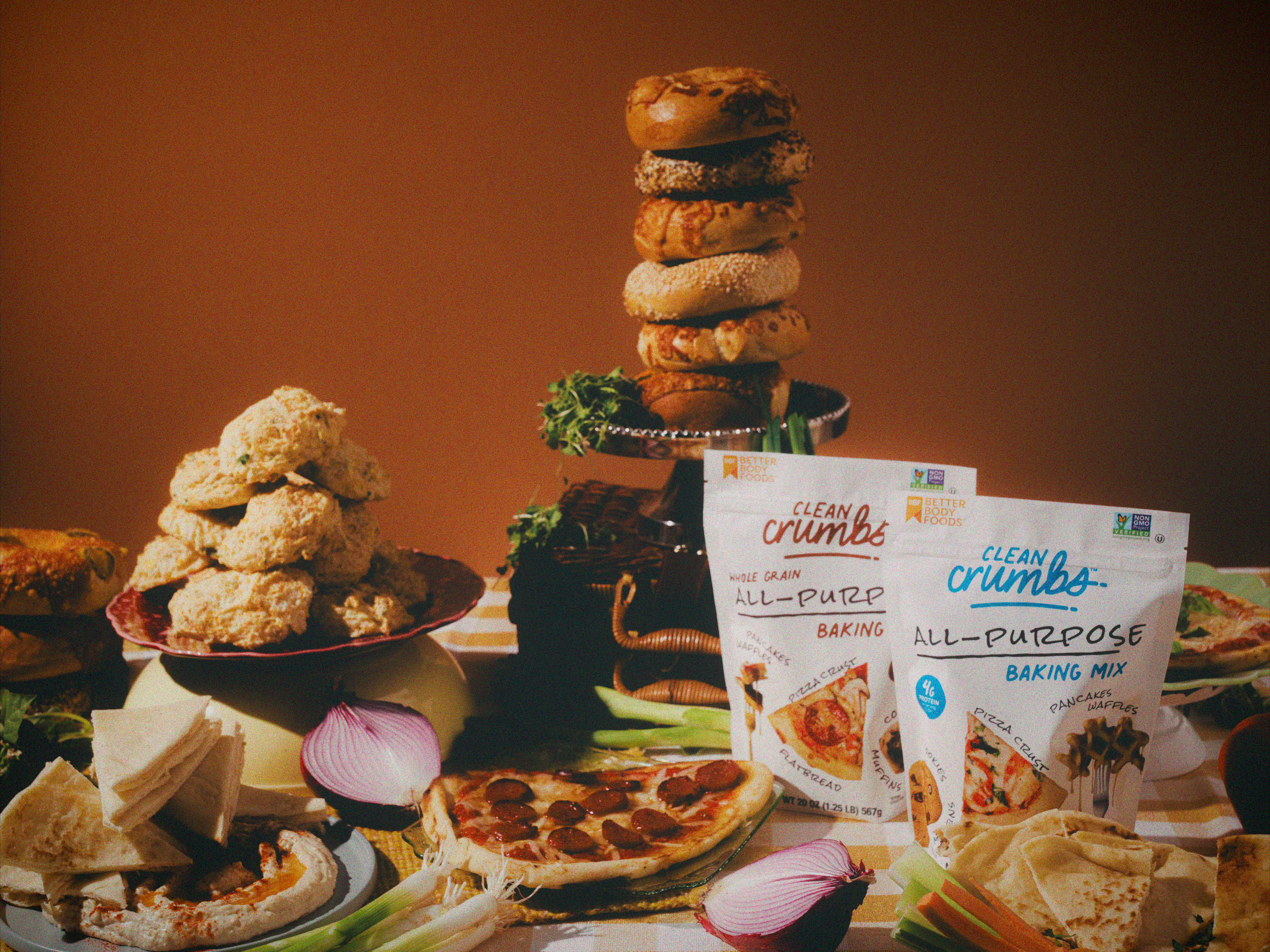 Clean Crumbs baking mix bags with savory baked goods and ingredients